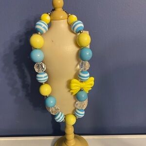 Cute bubble gum necklace with a bow tie blue yellow chunky style baby shower
